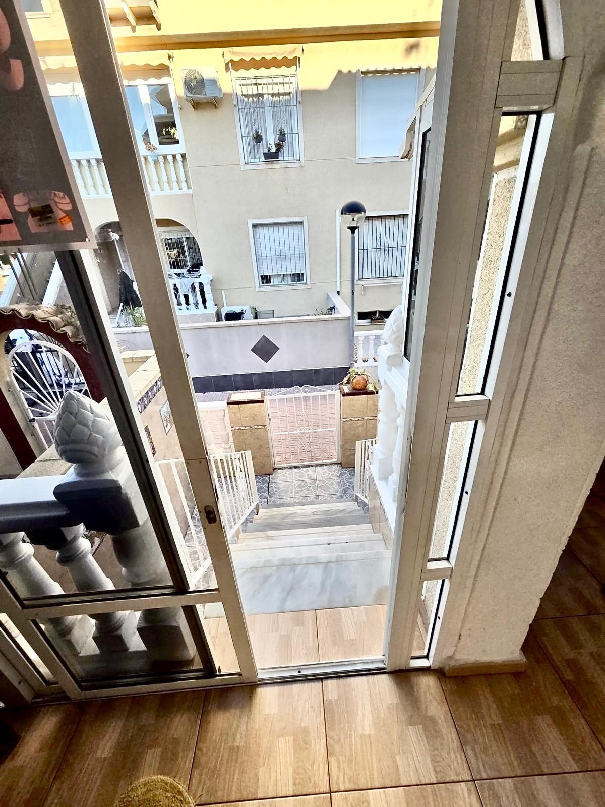 Townhouse with garage, solarium and pool in Laguna, Orihuela Costa