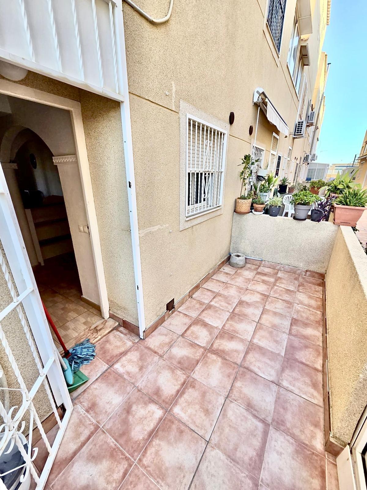 Townhouse with garage, solarium and pool in Laguna, Orihuela Costa